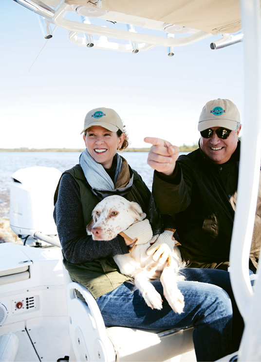 Doran adventures always include many four-legged family members. For years, Tracy and Bob have bred and raised Irish setters—including four national field trial champions—and now English setter Daisy, shown here, enjoys an ACE Basin boat outing.