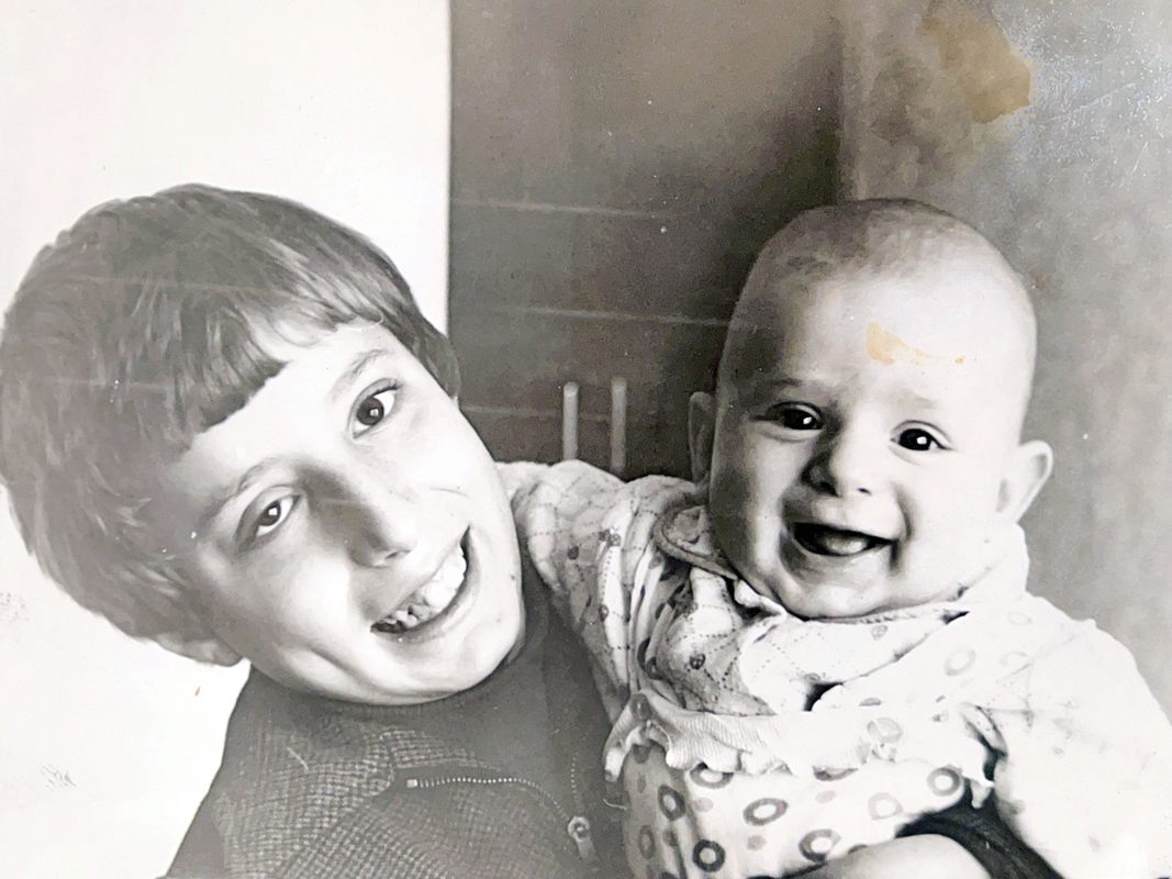 Yuriy with his brother, Dmitry, who is a decade older. “Despite the age gap, he has always been a generous and amazing brother,” says Yuriy. “I can count on him, rain or shine.”