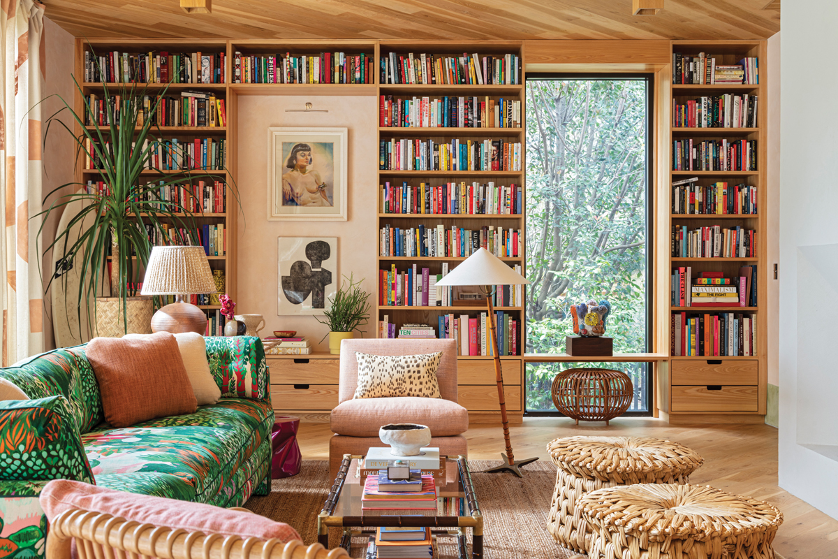 A vintage sofa covered in Jim Thompson’s “Melusine” fabric in “Sweet Nymph” dominates the main living space. Tucked under the end table is a fuchsia fiberglass stool from L.A. Studio in Madrid. But it’s the books that are the star of the show. “I incorporate bookshelves whenever possible into clients’ homes, and they are a source of joy and inspiration in my own,” says Hranowsky. “Books can tell you a lot about their owners. My collection is full of fiction and nonfiction, design books from interiors to graphics to architecture, along with art books and books I collect purely for the originality and beauty of their design.”