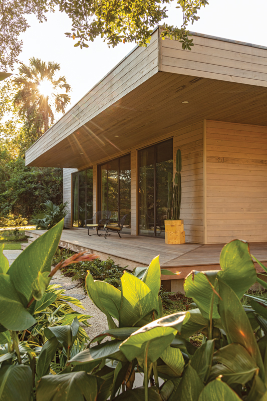The primary bathroom does double duty as a large closet, with intricate lattice doors to contain clutter and allow the room to feel sophisticated and simple. The yellow tiled floor and lime-based, waterproof Tadelakt plaster create a warm, soft space that’s flooded with natural light.