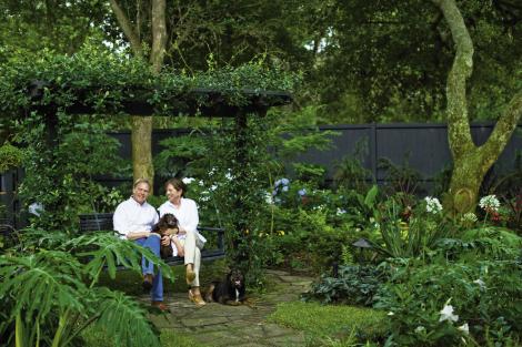 Backyard Oasis: Tommy and Sterling with their Boykin spaniel, Gibbes, and rescue hound, Walker.