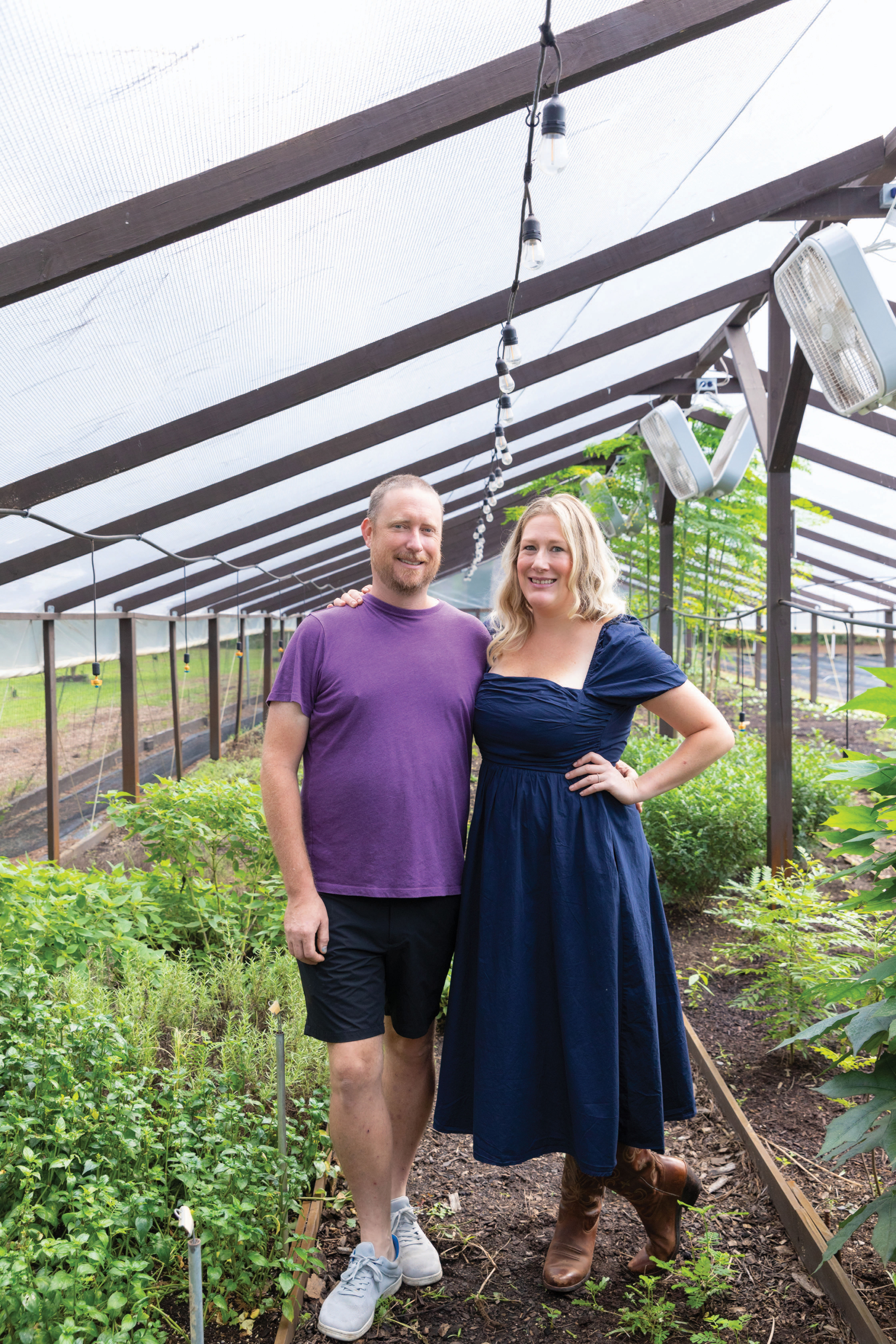 Dan and Amy Urbanik in the greenhouse of their five-acre Urb Farm on John’s Island.