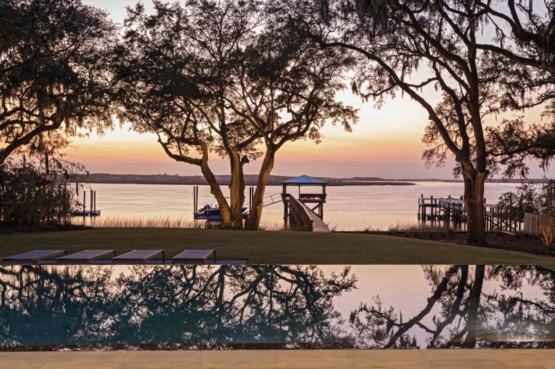 The infinity pool installed by Atkinson Pools sinks seamlessly into the garden, designed by landscape architect Steve Dudash.