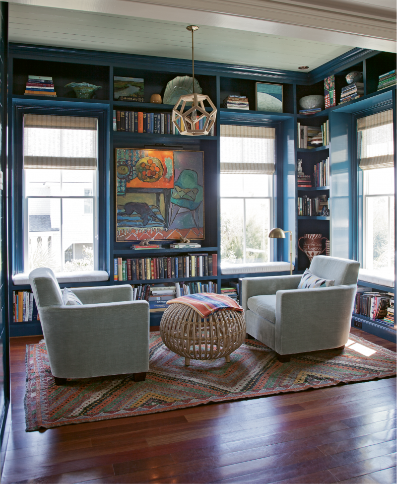 Reading Rainbow - For this small library, Cortney Bishop designed floor-to-ceiling shelves and built-in window seats and had them painted a shade of blue that matches the deep waters of the sea. Now filled with the homeowners’ books, family photos, artwork, and other keepsakes, it has become one of the couple’s favorite spaces.  Location: Sullivan’s Island, (owned by Lynne and  Steve Hamontree) Issue: September 2014, “Carolina by Way of California”  Photographer: Julia Lynn
