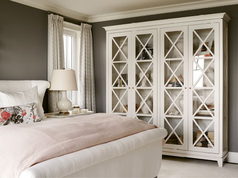 The custom bookcase holds mementoes, such as the conch shells Leah’s skin-diving husband has been pulling up for her since their honeymoon.