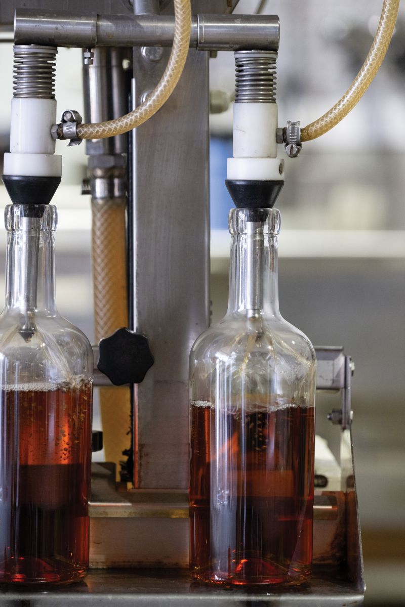 After three to four years aging in the warehouse, the bourbon is bottled, labeled, and boxed for distribution.