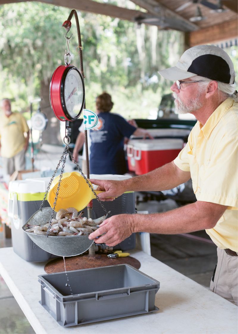 Selling shrimp at Mount Pleasant’s new Saturday morning fish market at Moultrie Middle School