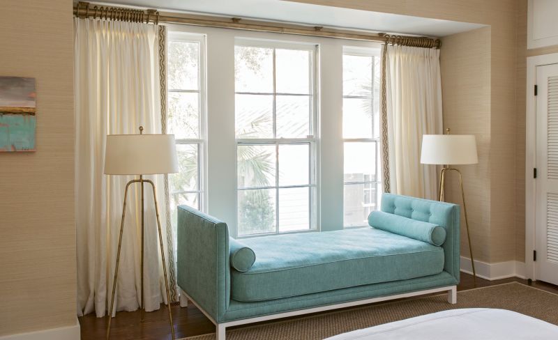 The custom settee in this guest room features a twin mattress covered in indoor/outdoor fabric, so it can pinch-hit as an additional guest bed.