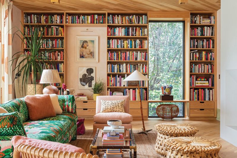 A vintage sofa covered in Jim Thompson’s “Melusine” fabric in “Sweet Nymph” dominates the main living space. Tucked under the end table is a fuchsia fiberglass stool from L.A. Studio in Madrid. But it’s the books that are the star of the show. “I incorporate bookshelves whenever possible into clients’ homes, and they are a source of joy and inspiration in my own,” says Hranowsky. “Books can tell you a lot about their owners. My collection is full of fiction and nonfiction, design books from interiors to graphics to architecture, along with art books and books I collect purely for the originality and beauty of their design.”