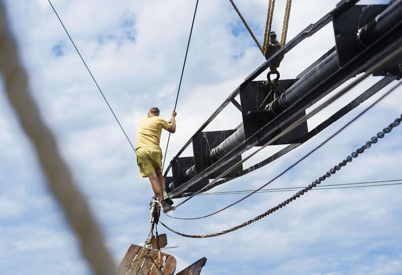 At about 3 p.m., the Warren H. Rector heads back to Shem Creek as Stephen White negotiates an outrigger to secure the nets.