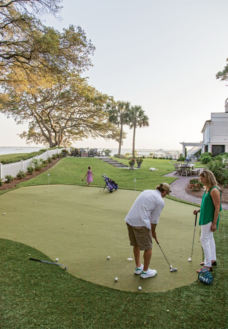 As the couple set out to create a backyard haven ideal for outdoor fun, David’s design skills came into play. His vision incorporated a putting green, an in-ground trampoline, an elevated fire pit, and stone pavers that cut a cool path through the sloping lawn.