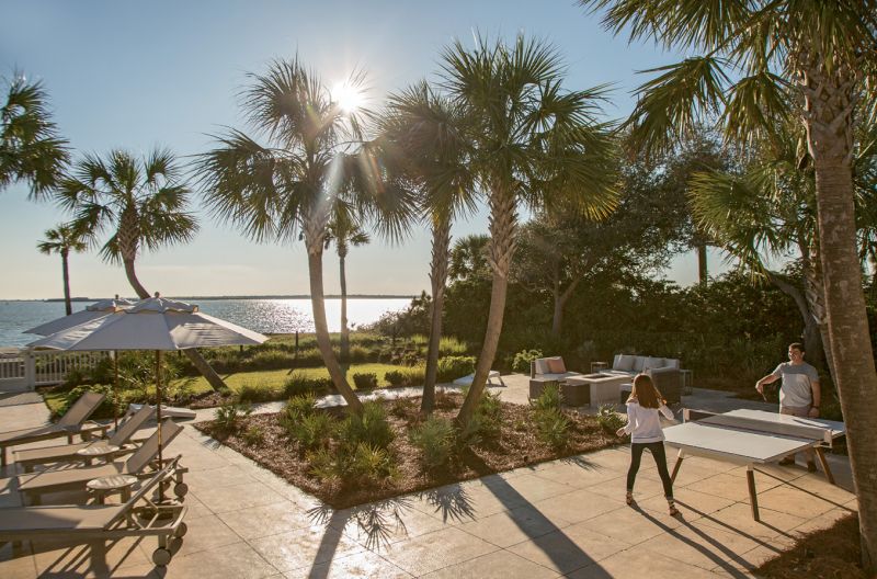 French doors frequently draw the family out onto the patio for a dip in the pool or a round of table tennis.