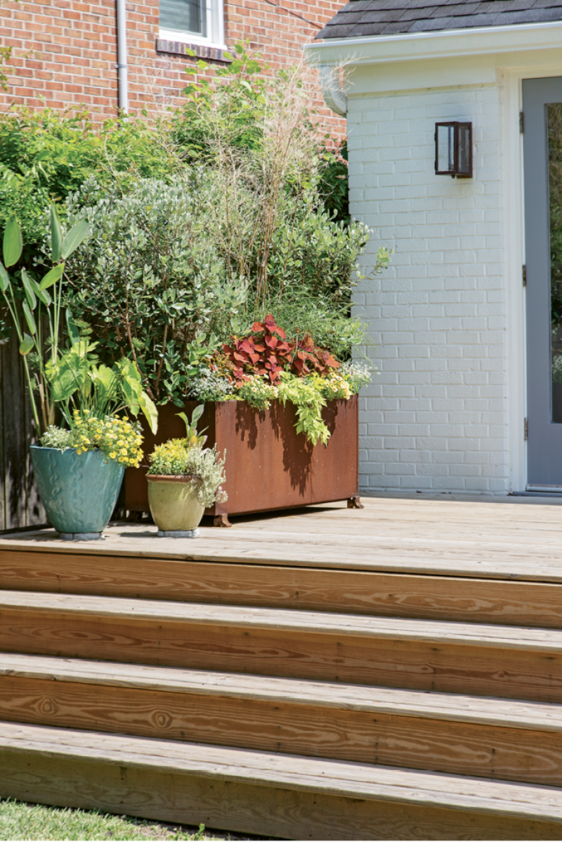 DECKED OUT: Come summer, the backyard planters (the rust-hued one was ordered from Houzz) are rife with coleus, Rachel’s favorite flora.