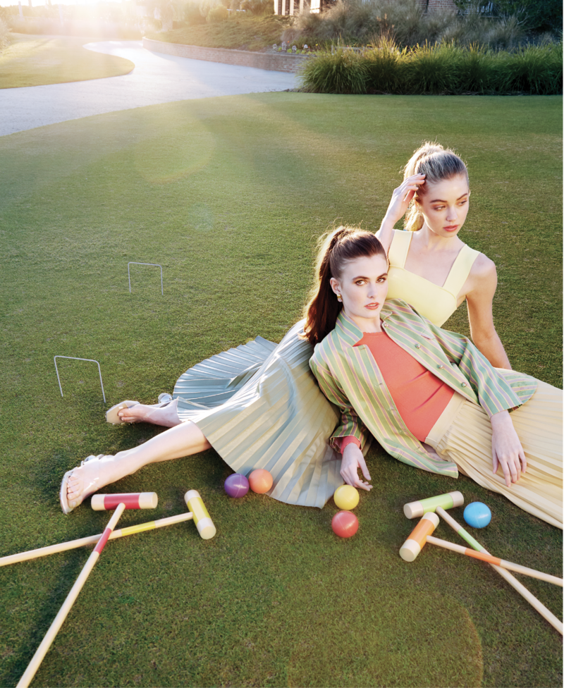 Time Out: (On Sara, left) Autumn Cashmere “Emily” one-shoulder top in “salmon,” $265 at Beckett Boutique; Péro striped blazer, $1,280 at RTW; pleated pleather skirt in “buttercup,” $94 at Maris DeHart; Julie Vos 24K gold-plate “Catalina Gold” earrings, $165 at Abide-A-While Garden Boutique; (on Maddie, right) Alice &amp; Olivia “Rashida” square-neck cropped tank in “Daffodil,” $102 at Gwynn’s of Mount Pleasant; pleated pleather skirt in “moss,” $94 at Maris DeHart; Jeffrey Campbell “Lateral” sandals, $145 at Shoes on King