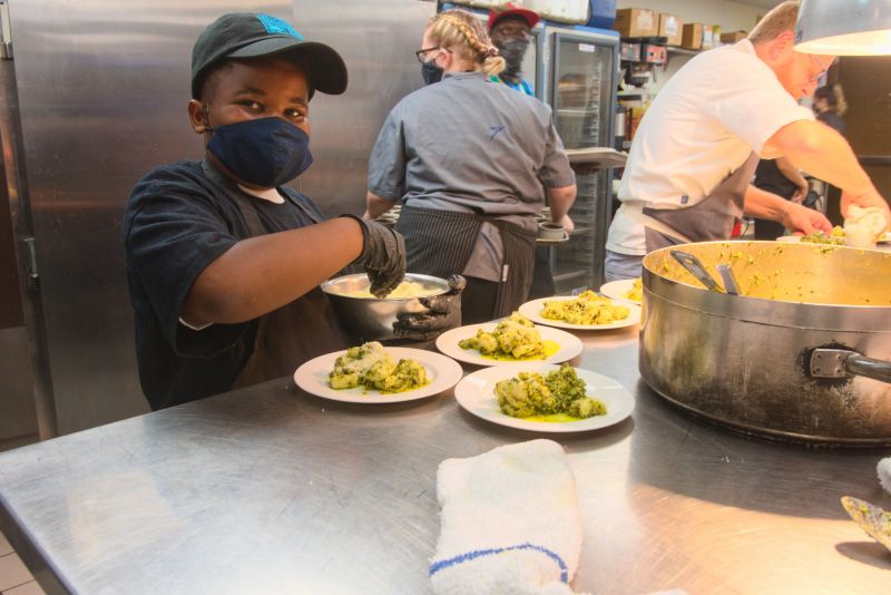 Little chef Grant Higgins, who was partnered with Rodney Scott, helps out.