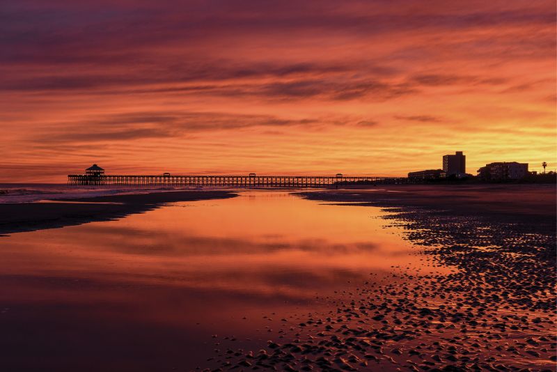 A dramatic sunset at low tide