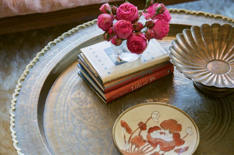 A fuzzy flokati rug and Moroccan brass tray reference the homeowner’s recent trip to the Mediterranean, where she fell for many of the region’s unique designs.