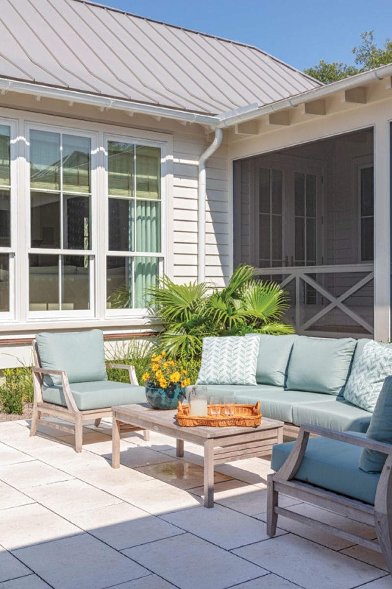 The deck leads to the dogtrot where the converted cobbler’s cottage now serves as a guest room/home office.
