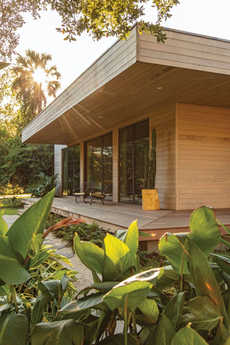The primary bathroom does double duty as a large closet, with intricate lattice doors to contain clutter and allow the room to feel sophisticated and simple. The yellow tiled floor and lime-based, waterproof Tadelakt plaster create a warm, soft space that’s flooded with natural light.