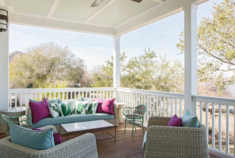 The pillows and cushions for the relaxed outdoor seating areas repeat the deep plum and soft blues from the living room.