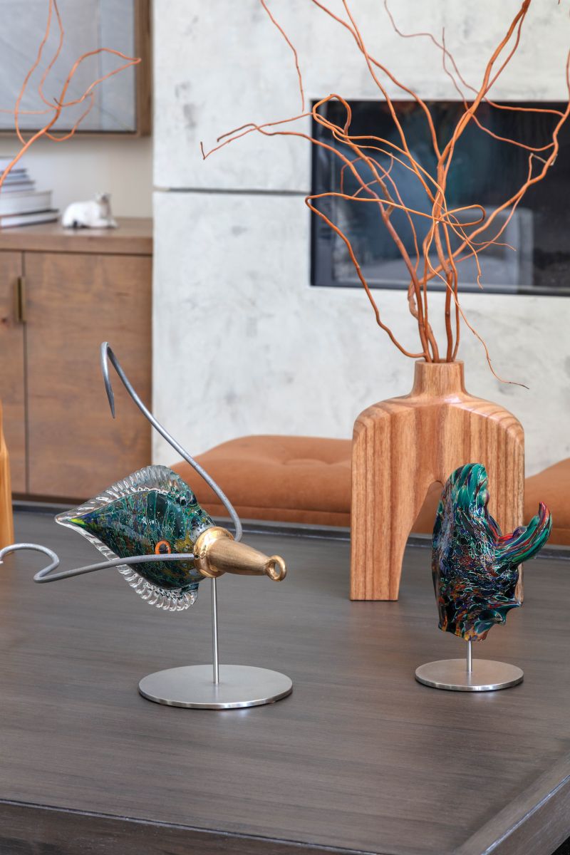 Squid and lobster claw sculptures by a Maine glass artist are among many objets and furnishings interior designer Mikala Kuchera worked into the home. “Clients’ existing pieces often have a story or special meaning, so I enjoy finding a way to incorporate them,” she says.