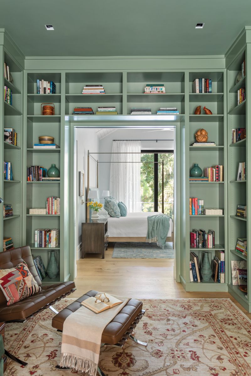 The swing-arm sconce from Allied Maker serves both the lounge chair and sofa areas.