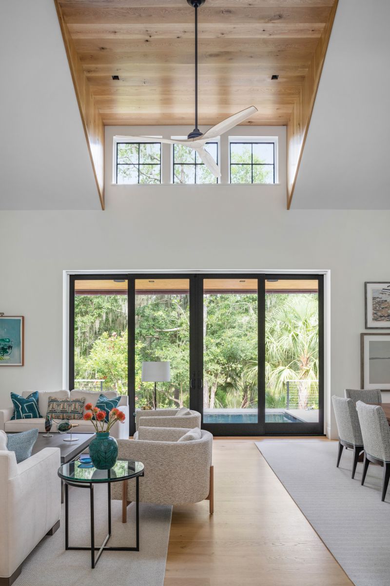 Benjamin Moore “Cloud White” painted throughout the open space creates an ideal backdrop for showcasing the homeowners’ art collection.