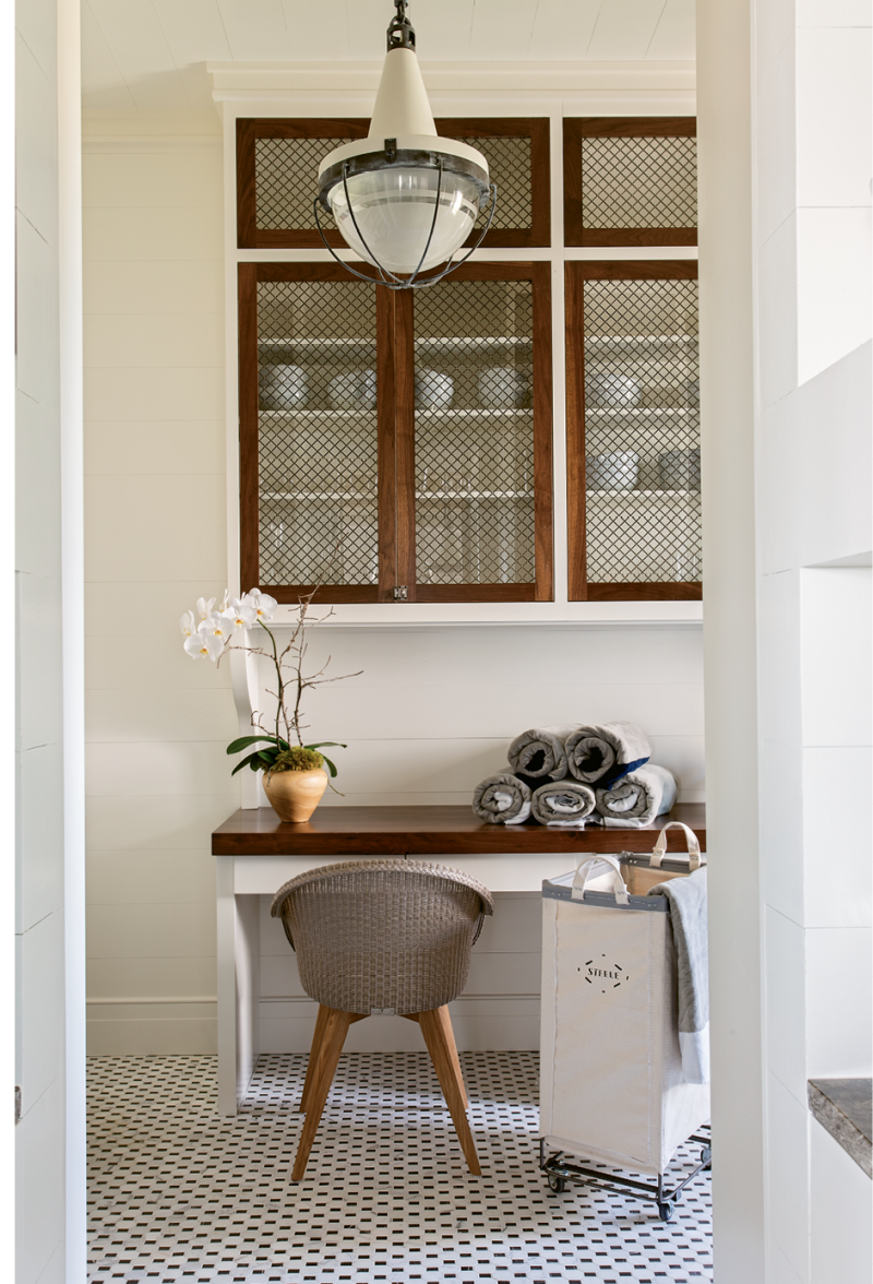 Vintage Charm: In the laundry room, walnut accents and a vintage-inspired Urban Electric light fixture set a nostalgic tone.