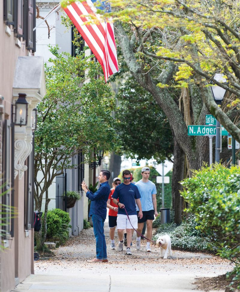 Tourists and residents navigate shared public space on East Bay Street.