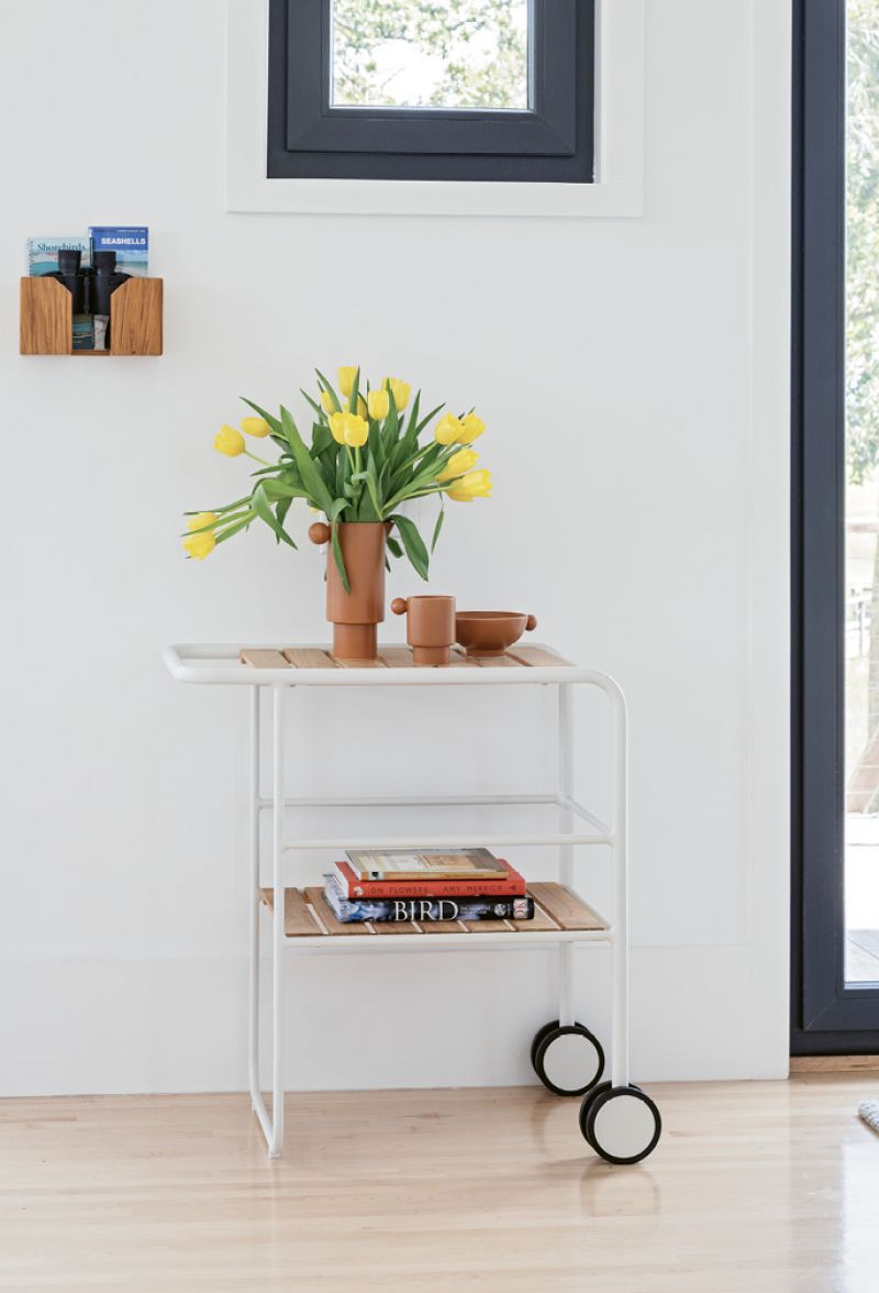 In each room, a wall-mounted birding box, complete with binoculars and a field guide (above), is conveniently located near a window for keeping tabs on their feathered neighbors.