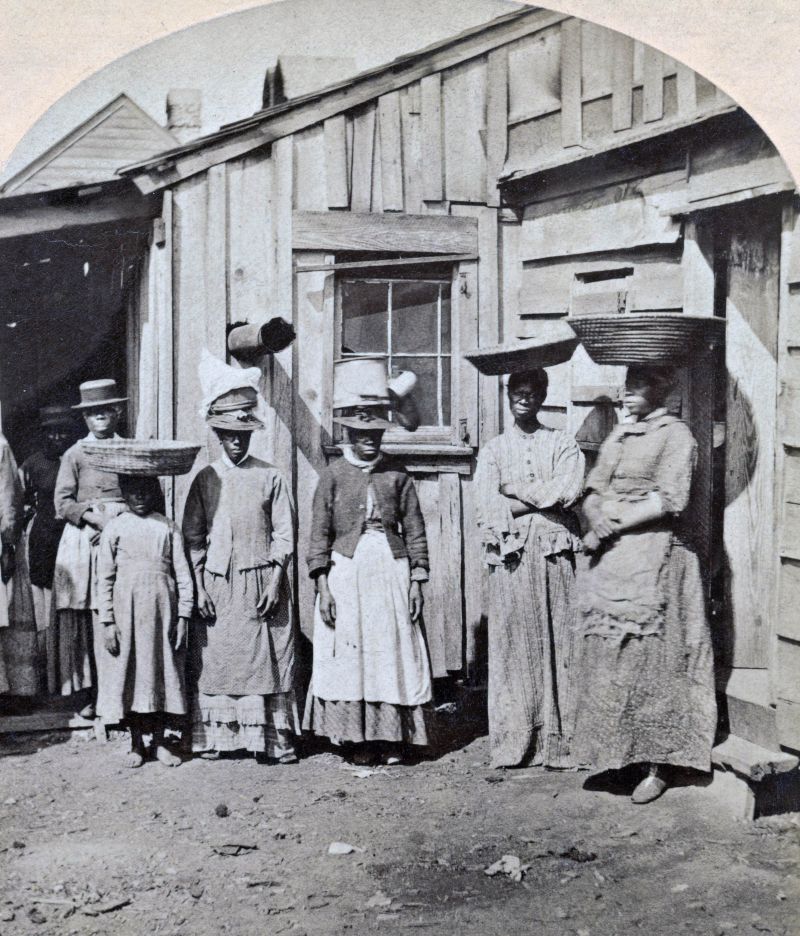 A circa-1870 stereograph of African American women selling oysters and fish in Charleston.