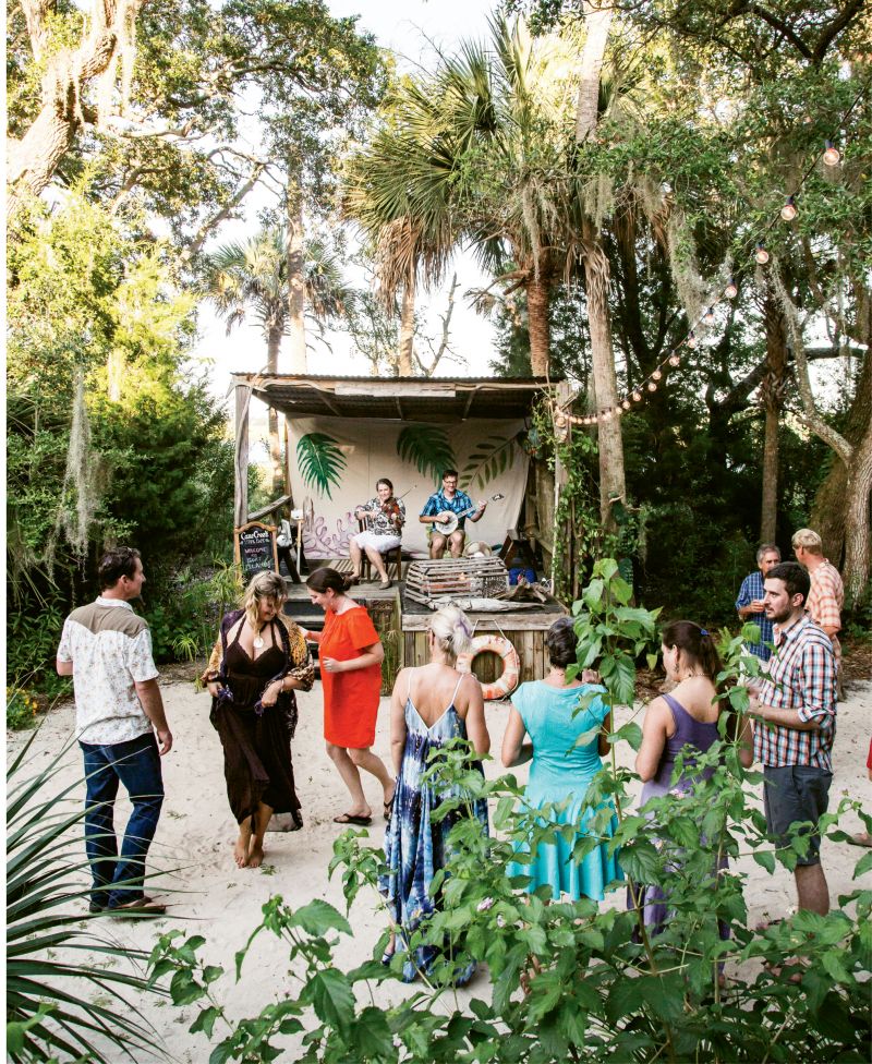 Guests sip and sway to the upbeat harmonies of Cane Creek String Band.