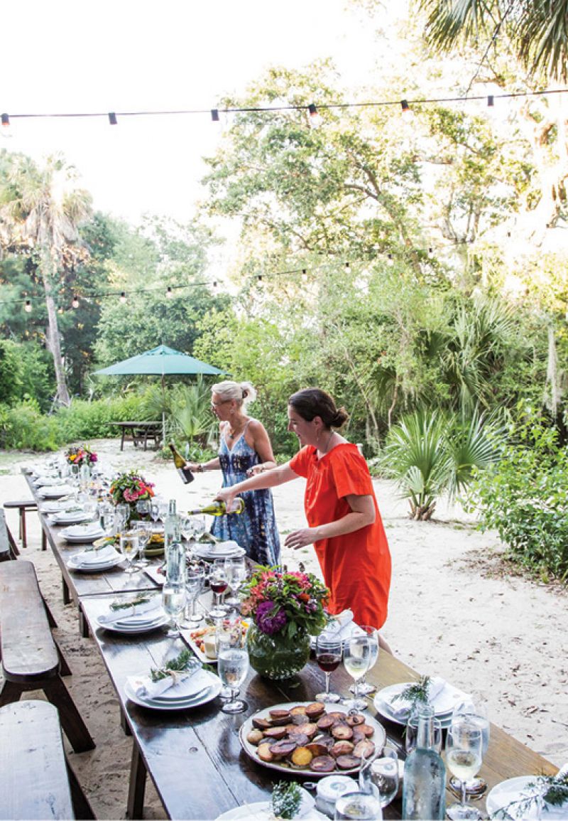 Colleen and Helena Fox Fraser set the table.