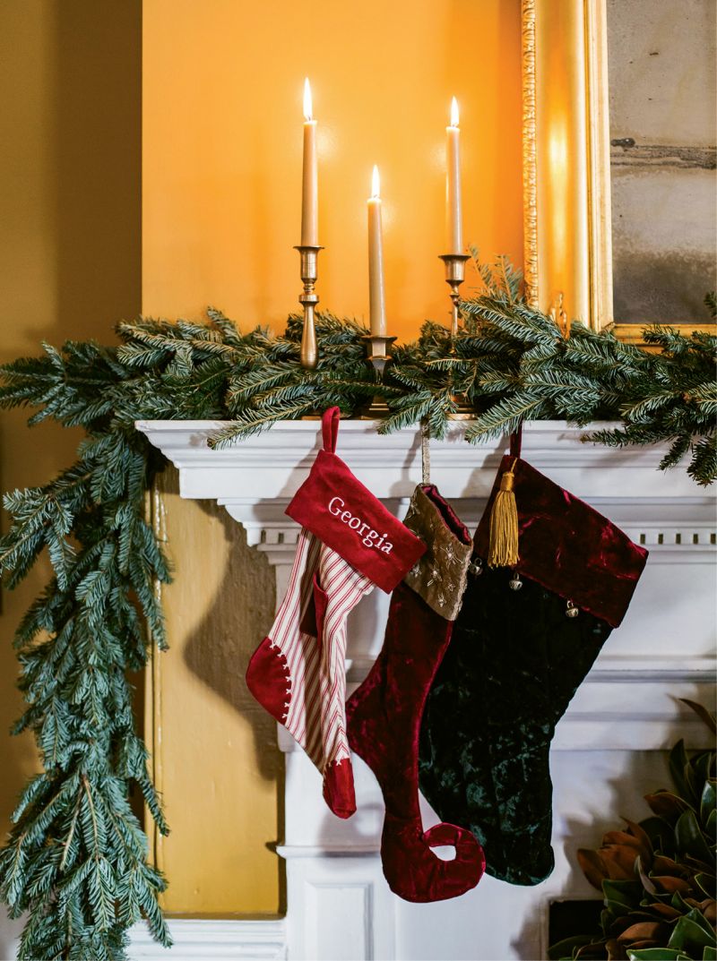 HANG WITH CARE: Simply weaving garlands amid mantel decorations works for Tara, as does lighting candles. “Just don’t burn scented candles around food,” she says.