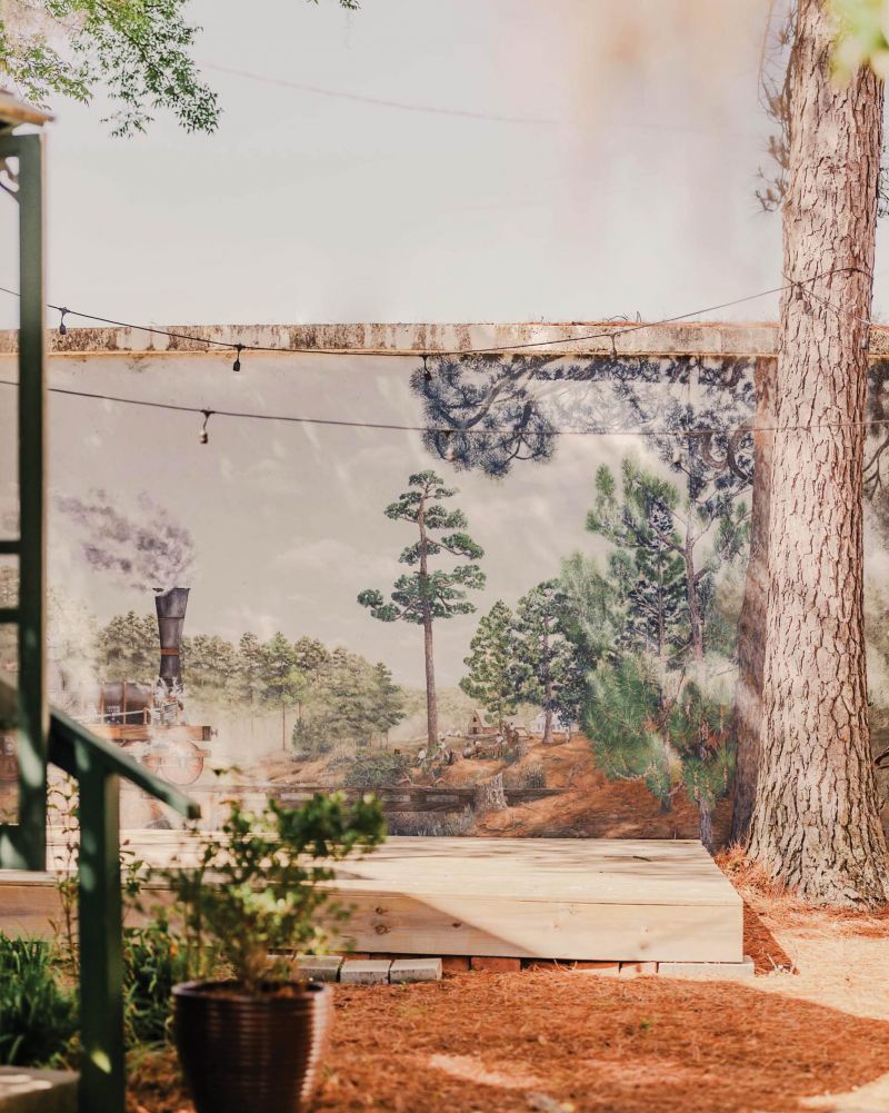 A train mural behind the Summerville Museum marks the importance of the railroad in establishing the town.