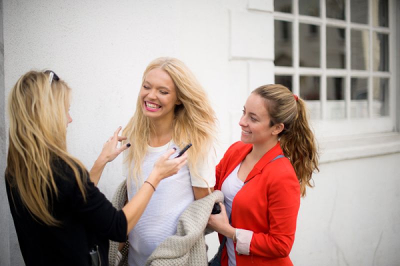 Hair and makeup Ashely Brook Perryman (left) primps our model between takes