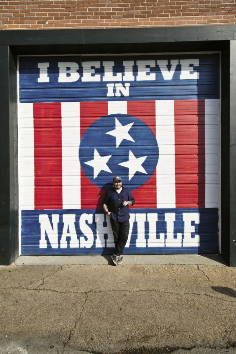 While in Marathon Village, Brock stops in front of a mural by Nashville artist Adrien Saporiti.