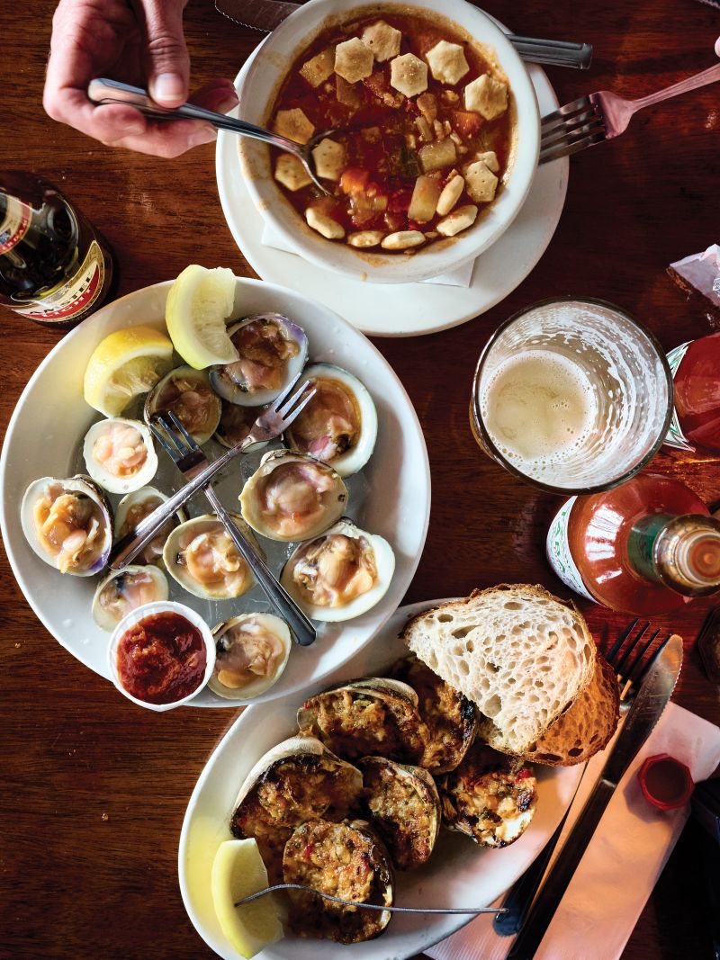 Three clam dishes—chowder, on the half-shell, and clams casino—at The Dock.